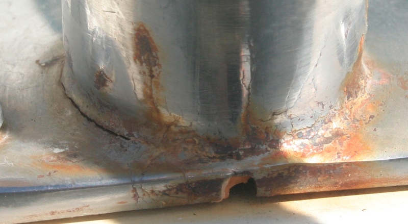 Severe crevice corrosion with cracks in stanchion base